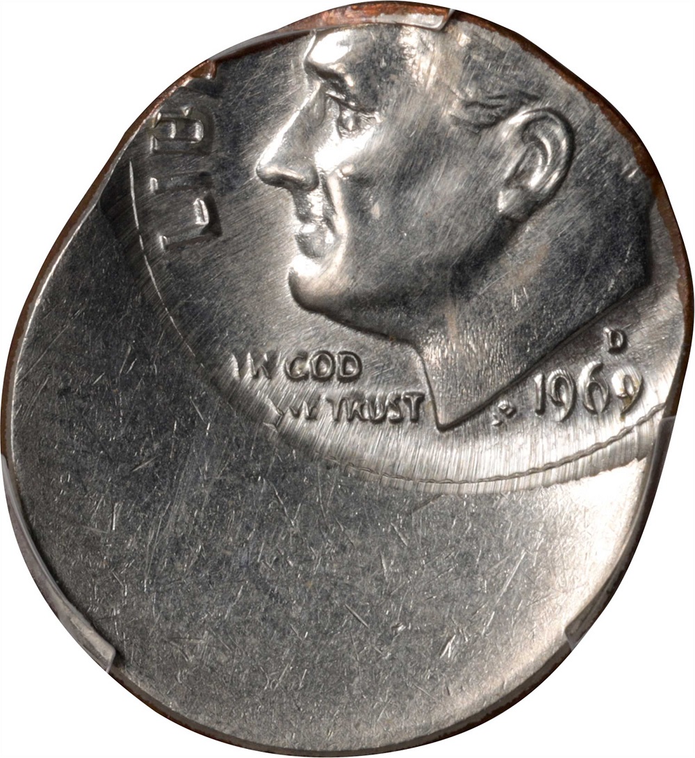 1969 Roosevelt dime off-center strike error showing shifted design with blank crescent area and visible date